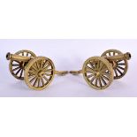 A PAIR OF ANTIQUE GENTLEMANS BRONZE DESK CANNONS. 16 cm x 10 cm.