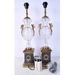 A pair of cut glass and bronze lamp stands with marble plinths and decorated with gilt birds 64 cm (