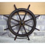 A large metal bound ships wheel 138 cm