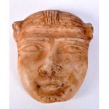A carved Central Asian alabaster head 14 x 12 cm.