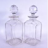 A PAIR OF ANTIQUE WHISKEY GLASS DECANTERS. 26 cm high.