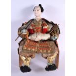 A LARGE JAPANESE TAISHO PERIOD SAMURAI FIGURE modelled in armour holding a fan. 40 cm x 20 cm.