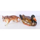 A Ceramic duck together with a ceramic leopard 11 x 22 cm