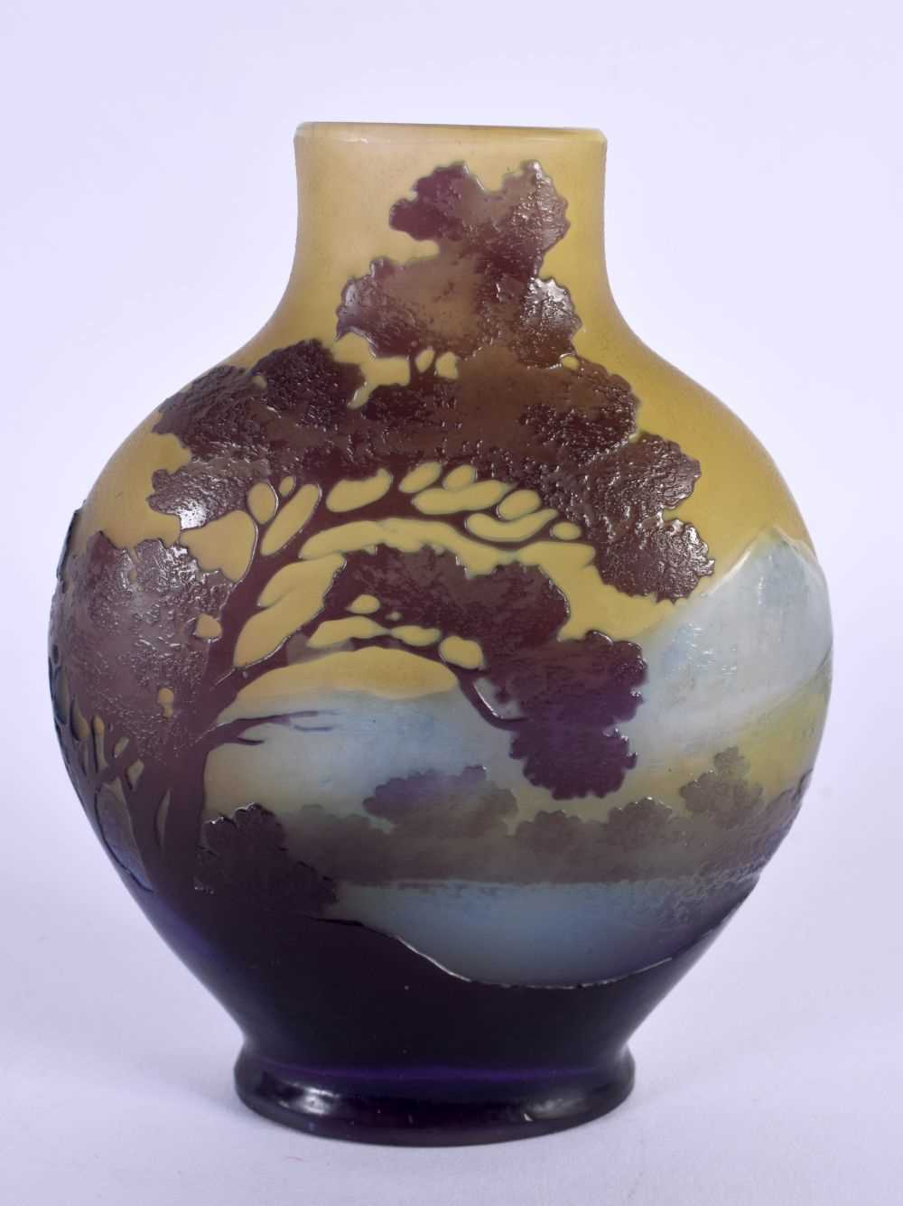 A FINE EARLY 20TH CENTURY FRENCH GALLE TRIPLE LAYER GLASS VASE decorated with landscapes. 12 cm x