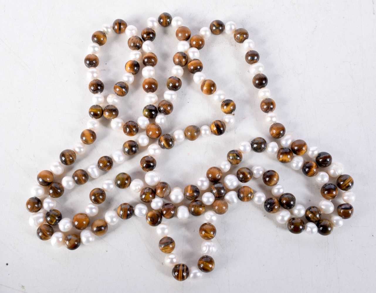 A HARDSTONE BEAD NECKLACE. 124cm long, Bead size 8mm, weight 104g