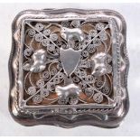 A SILVER SNUFF BOX WITH A HEAVILY EMBOSSED AND FILIGREE COVER. Stamped Sterling, 5.1cm x 4.8cm x 2.