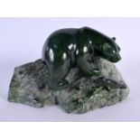 A FINE NORTH AMERICAN INUIT CARVED JADE FIGURE OF A POLAR BEAR modelled pursuing a seal pup. 16 cm x