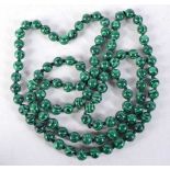 A MALACHITE BEAD NECKLACE. 96cm long, Bead size 8mm, weight 62g