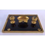 A 19TH CENTURY FRENCH ORMOLU EMPIRE INKSTAND formed with swans. 34 cm x 24 cm.