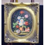 A framed oil on board still life study of flowers signed with monogram 47 x 38 cm.