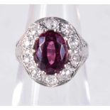 A RUBY AND DIAMOND CLUSTER RING. Size G, weight 3.5g