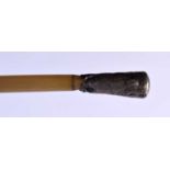 A 19TH CENTURY MIDDLE EASTERN CARVED RHINOCEROS HORN SWAGGER STICK. WEIGHT. 53 cm long.