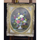 A Framed still life oil on canvas of flowers 52 x 44 cm