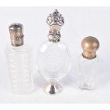 THREE GLASS SCENT BOTTLE WITH SILVER MOUNTS. Stamped 800, Largest 10.2cm x 3.9cm x 1.6cm (3)