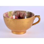 A ROYAL WORCESTER FRUIT PAINTED TEACUP by Ricketts. 7 cm wide.