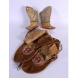 A PAIR OF NORTH AMERICAN MOCCASINS together a pair of tribal silk work boots. Largest 27 cm long. (