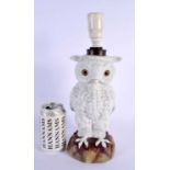 A SMALLER 19TH CENTURY GERMAN PORCELAIN OWL TABLE LAMP of naturalistic form. 32 cm x 12 cm.