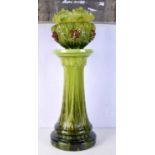 A green glazed Bretby jardiniere on stand, decorated with grapes. 87 cm high.