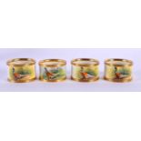 FOUR WORCESTER GRAHAM PAYNE STUDIOS PORCELAIN NAPKIN RINGS painted with game birds. 5 cm