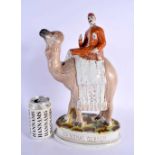 A LARGE ANTIQUE STAFFORDSHIRE FIGURE OF GENERAL GORDON modelled upon a camel. 35 cm x 17 cm.