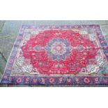 A large Persian rug 327 x 244 cm (R/L 3143 3.1.23)