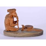 A 19TH CENTURY ANGLO INDIAN CARVED SANDALWOOD AND RHINOCEROS HORN FIGURE modelled as the snake