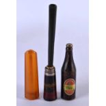 AN ART DECO AMBER CHEROOT HOLDER together with another cheroot & a novelty Charles Wells bottle