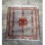 A small Oriental rug 67 x62 cm