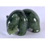 A NORTH AMERICAN CARVED JADE FIGURE OF A BEAR AND SALMON. 5 cm x 3.25 cm.