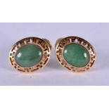 A PAIR OF 14CT GOLD JADEITE EARRINGS. 3.2 grams. 1.25 cm x 1 cm.