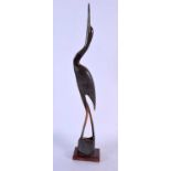 A MIDDLE EASTERN CARVED BUFFALO HORN FIGURE OF A BIRD. 44 cm long.