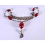 AN ART DECO STERLING SILVER CHERRY AMBER NECKLACE. 23.8 grams. 78 cm long, largest bead 2.5 cm x 2