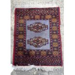 An Oriental prayer rug 65 x 21 cm