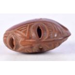 An African Tribal carved nut in the form of a ceremonial mask. 5cm x 2.5cm, weight 18g