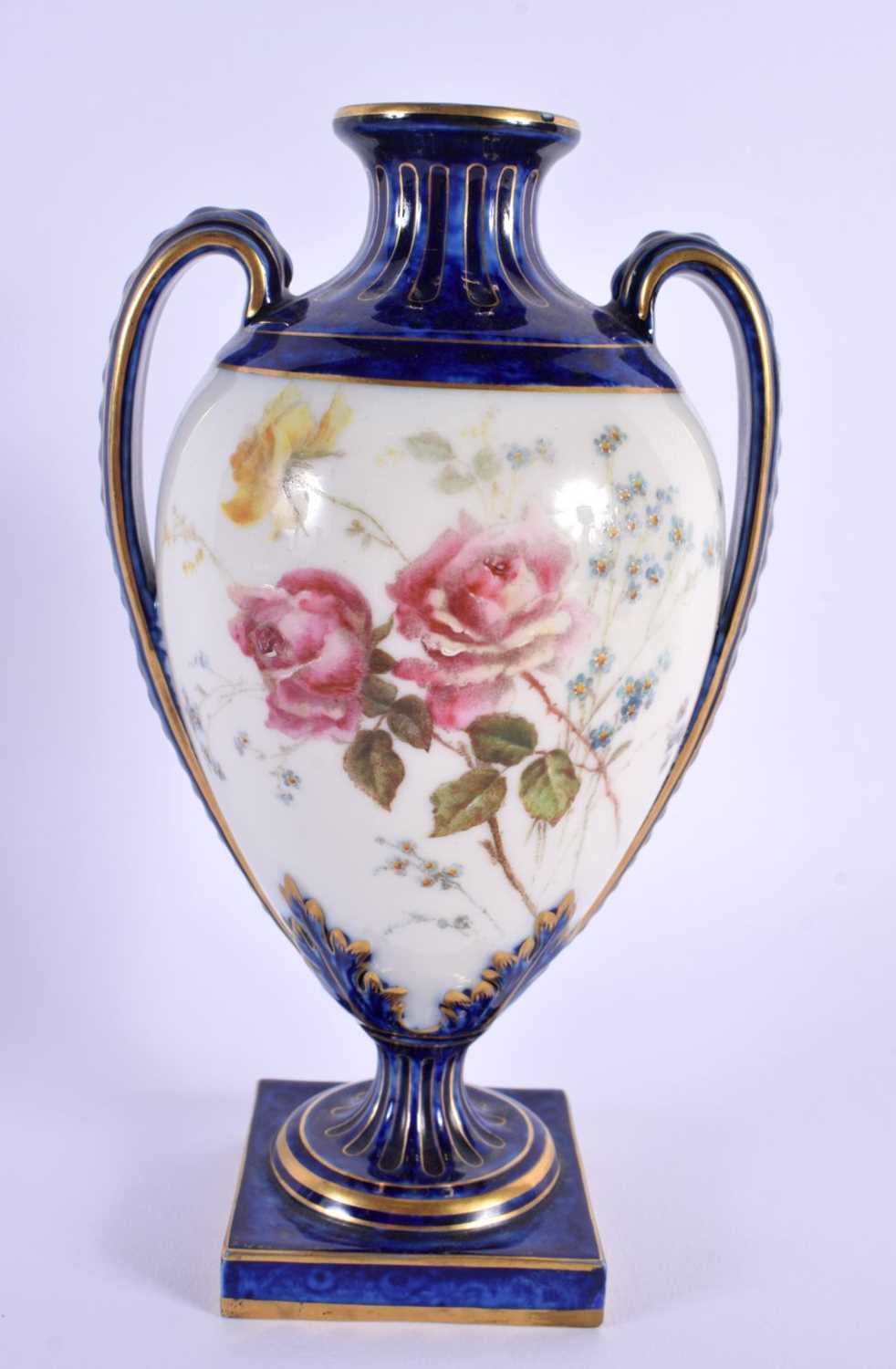 A 19TH CENTURY ROYAL WORCESTER TWIN HANDLED VASE painted with flowers. 18 cm x 10 cm.