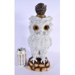 A LARGE 19TH CENTURY GERMAN PORCELAIN OWL TABLE LAMP of naturalistic form. 40 cm x 12 cm.