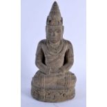 A 19TH CENTURY SOUTH EAST ASIAN CARVED STONE FIGURE OF A BUDDHA modelled with hands clasped upon a