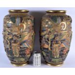 A LARGE PAIR OF LATE 19TH CENTURY JAPANESE MEIJI PERIOD SATSUMA VASES decorated in relief with