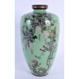 A 19TH CENTURY JAPANESE MEIJI PERIOD CLOISONNE ENAMEL VASE decorated with birds in flight upon an