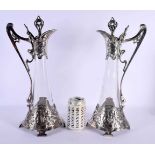 A FINE LARGE PAIR OF ART NOUVEAU WMF SILVER PLATED CLARET JUGS overlaid with portraits and