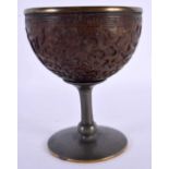 A 17TH/18TH CENTURY CHIINESE CARVED COCONUT CUP GOBLET Kangxi/Yongzheng, mounted in 19th century