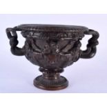 A 19TH CENTURY EUROPEAN TWIN HANDLED BRONZE WARWICK VASE depicting classical mask heads and