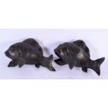 A PAIR OF 19TH CENTURY JAPANESE MEIJI PERIOD BRONZE OKIMONO modelled as flailing fish. 15 cm x 10