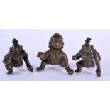 THREE 18TH/19TH CENTURY INDIAN BRONZE FIGURES OF ROAMING BUDDHA all modelled resting upon one leg.