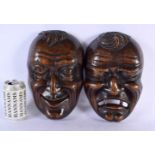 A LOVELY LARGE PAIR OF 19TH CENTURY JAPANESE MEIJI PERIOD CARVED HARDWOOD WALL MASKS depicting