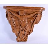 A LOVELY ART DECO CARVED WOOD WALL BRACKET formed as a stylised female holding aloft a draped dress.