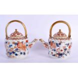 A PAIR OF 18TH CENTURY JAPANESE EDO PERIOD FLUTED IMARI TEAPOTS AND COVERS painted with flowers