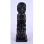 A NORTH AMERICAN TRIBAL HAIDA ARGILLITE MODEL TOTEM POLE CARVING depicting a figure upon a beast