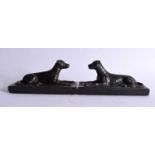 A PAIR OF 18TH CENTURY ENGLISH BRONZE FIGURES OF HOUNDS modelled upon later slate bases. 17 cm x 9