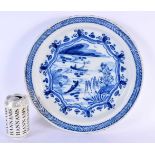 A LARGE 18TH CENTURY DUTCH DELFT BLUE AND WHITE DISH painted with figures on boats. 33 cm diameter.